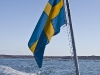 The Swedish flag at the back of the boat.