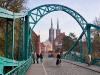 Tumski Bridge going to Cathedral Island with the Cathedral of St. John the Baptist in the distance.