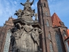 Church of the Holy Cross. Actually there are two churches in one building, the other being St. Bartholomew\'s each having a separate main hall.  Monument of John of Nepomuk.