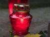 Below the statue of Mary in the front of St. John the Baptist Cathedral someone left a candle and leaf.