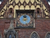 The clock on the front of city hall.