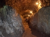 Looking down another tunnel as the tour moves into the distance.