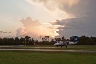 The sun was getting close to setting before their plane took off making for some great color.