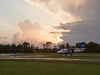 The sun was getting close to setting before their plane took off making for some great color.