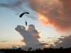 A jumper lands with a spectacular sunset in their background on the first day of the 4-way meet at the 2009 USPA Nationals.