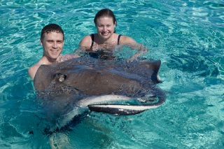 Chad and Rhonda holding a stingray.