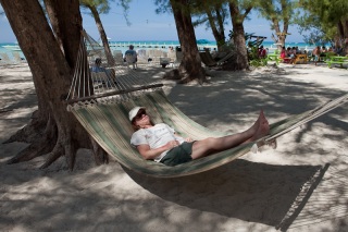 Rhonda relaxing on a hammock at Rum Point beach.