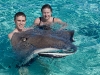 Chad and Rhonda holding a stingray.