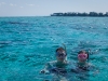 Chad and Rhonda snorkeling.  Rum Point is in the distance.